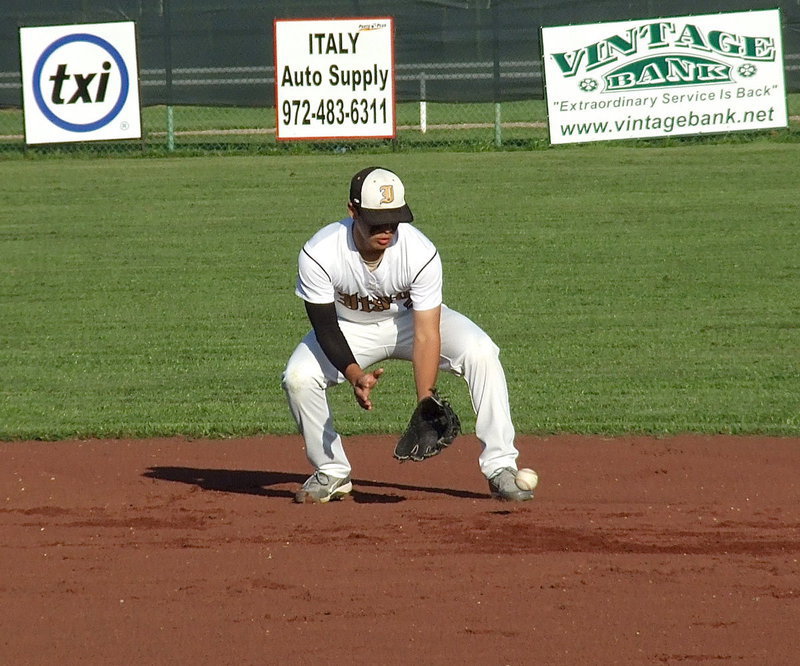 Image: Reid Jacinto(5) covers a grounder between innings during Senior Day.