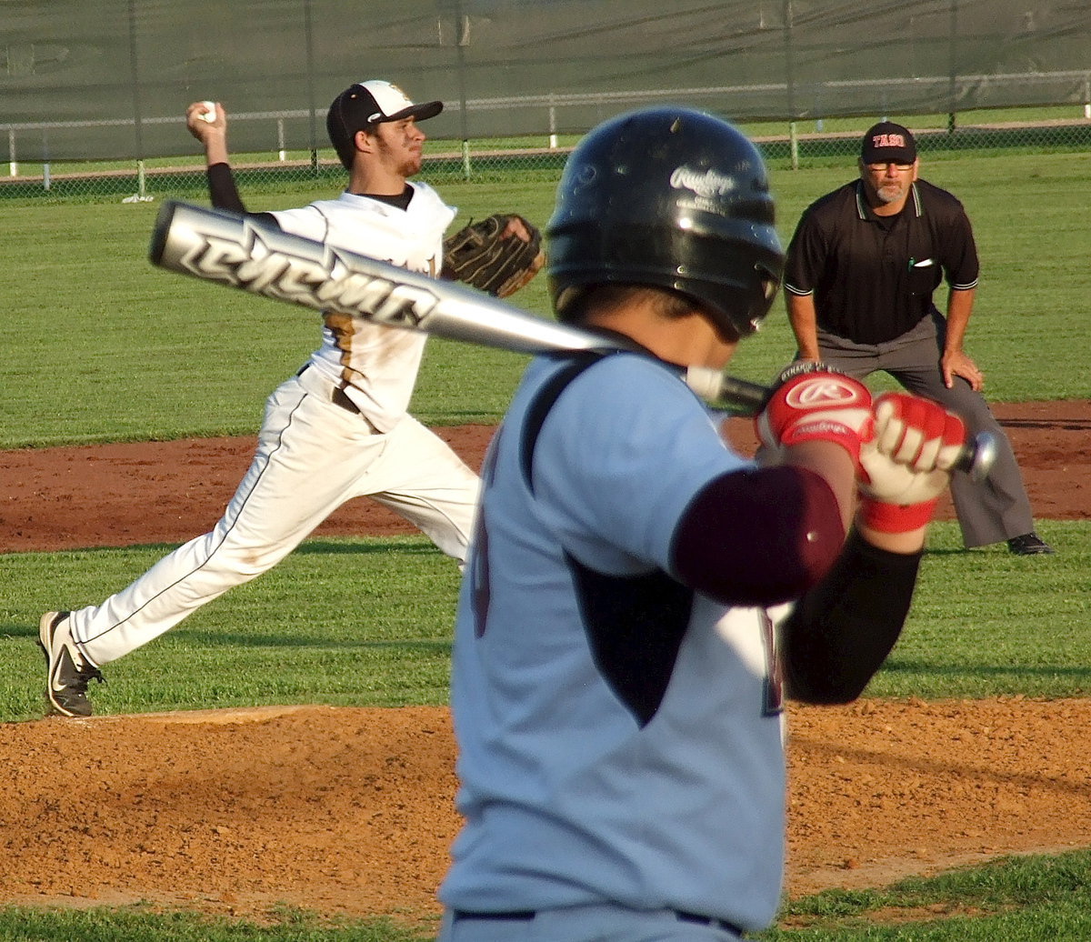 Image: Caden Jacinto(2) tries to catch an Eagle player napping at first base.