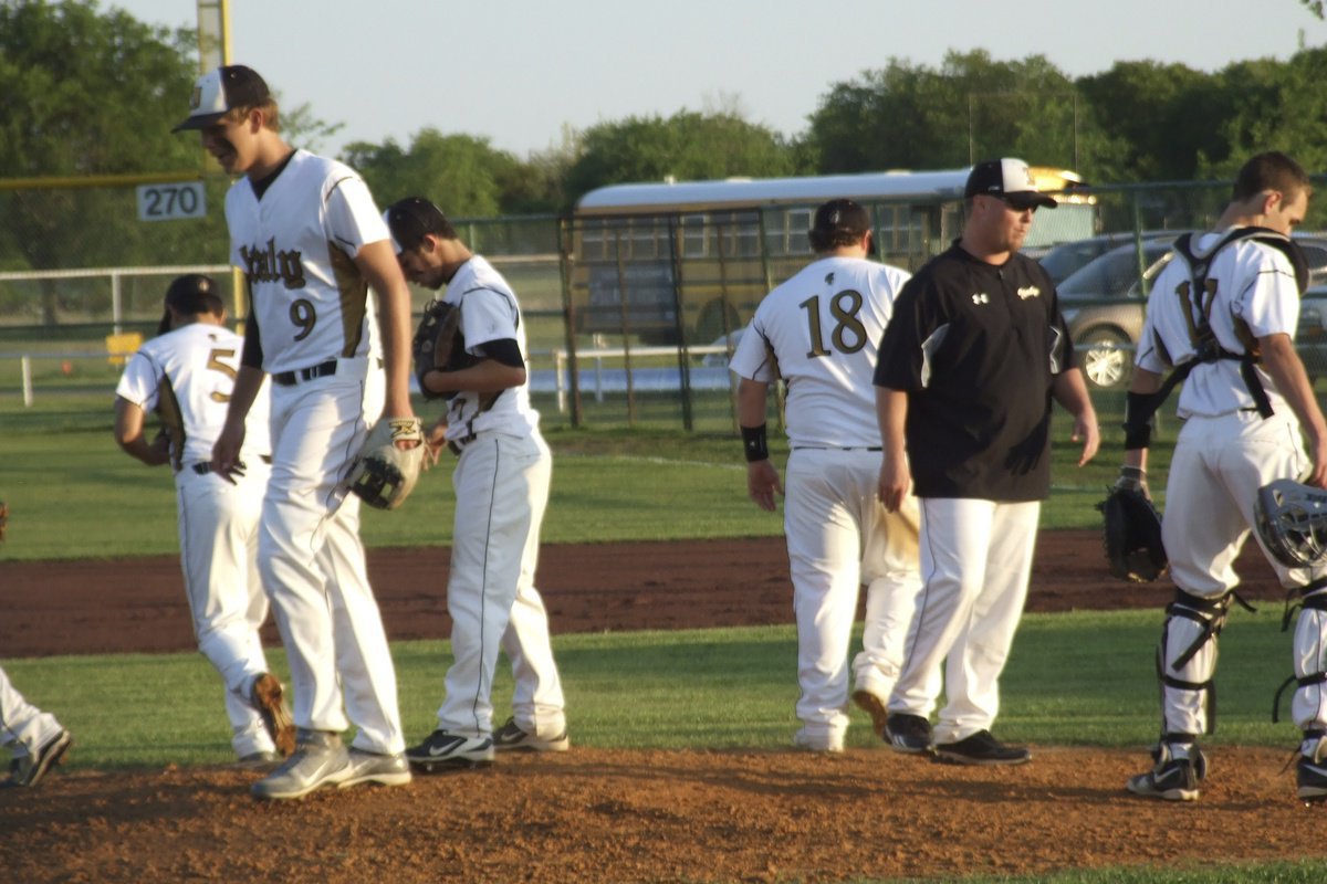 Image: Head coach Josh Ward and Italy’s infielder check on pitcher Caden Jacinto(2) who is determined to lead his team to a win and at least a share of the district title.