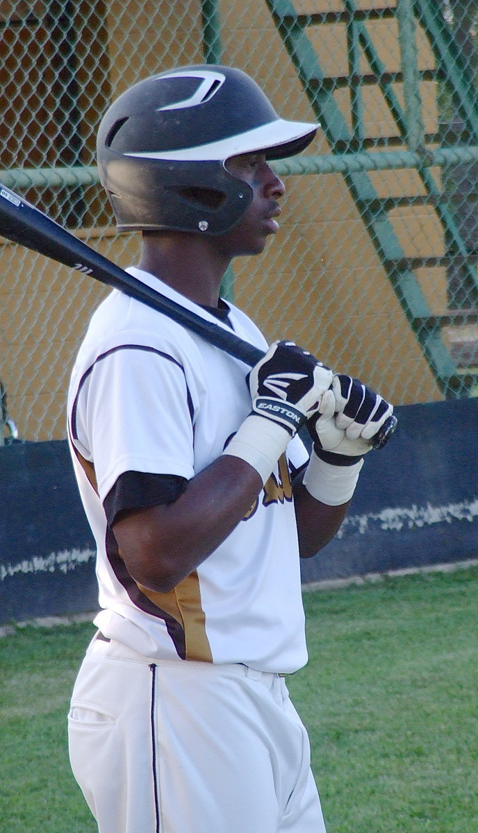 Image: Marvin Cox/(3) studies Waxahachie Faith Family’s pitcher.