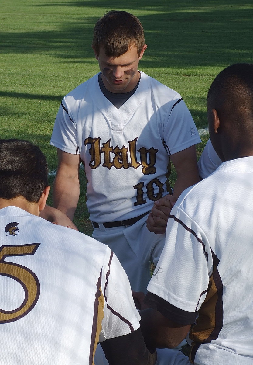 Image: Senior Chase Hamilton(10) joins his teammates in prayer during Senior Day 2013.