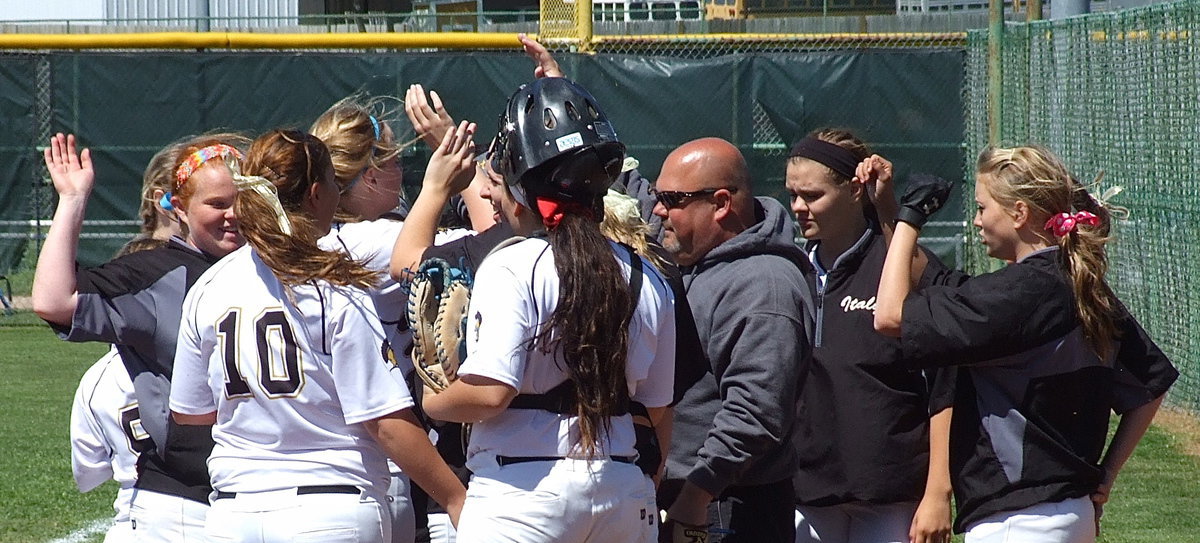 Image: Slap hands, slap hands! head coach Wayne Rowe joins his ladies in celebrating strong defensive play.