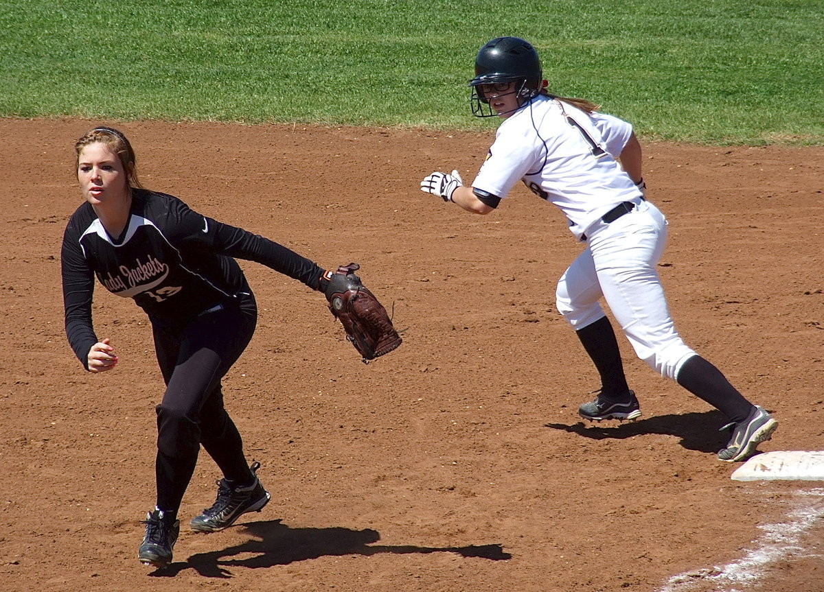 Image: Bailey Eubank(1) takes off from first as the Ferris pitch is released.