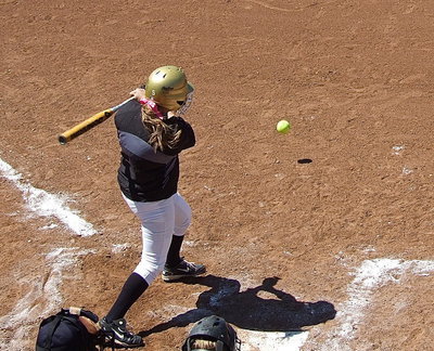 Image: Hannah Washington(6) hits the ball into play.