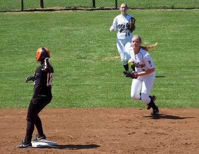 Image: Kelsey Neslon(14) and Madison Washington(2) hold a Ferris runner at second base.