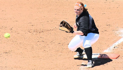 Image: First baseman Katie Byers(13) makes the catch for an out.