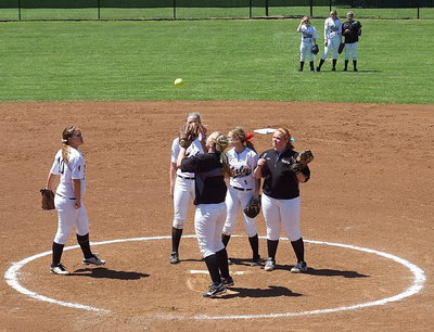 Image: The Lady Gladiators get ready to start an inning.