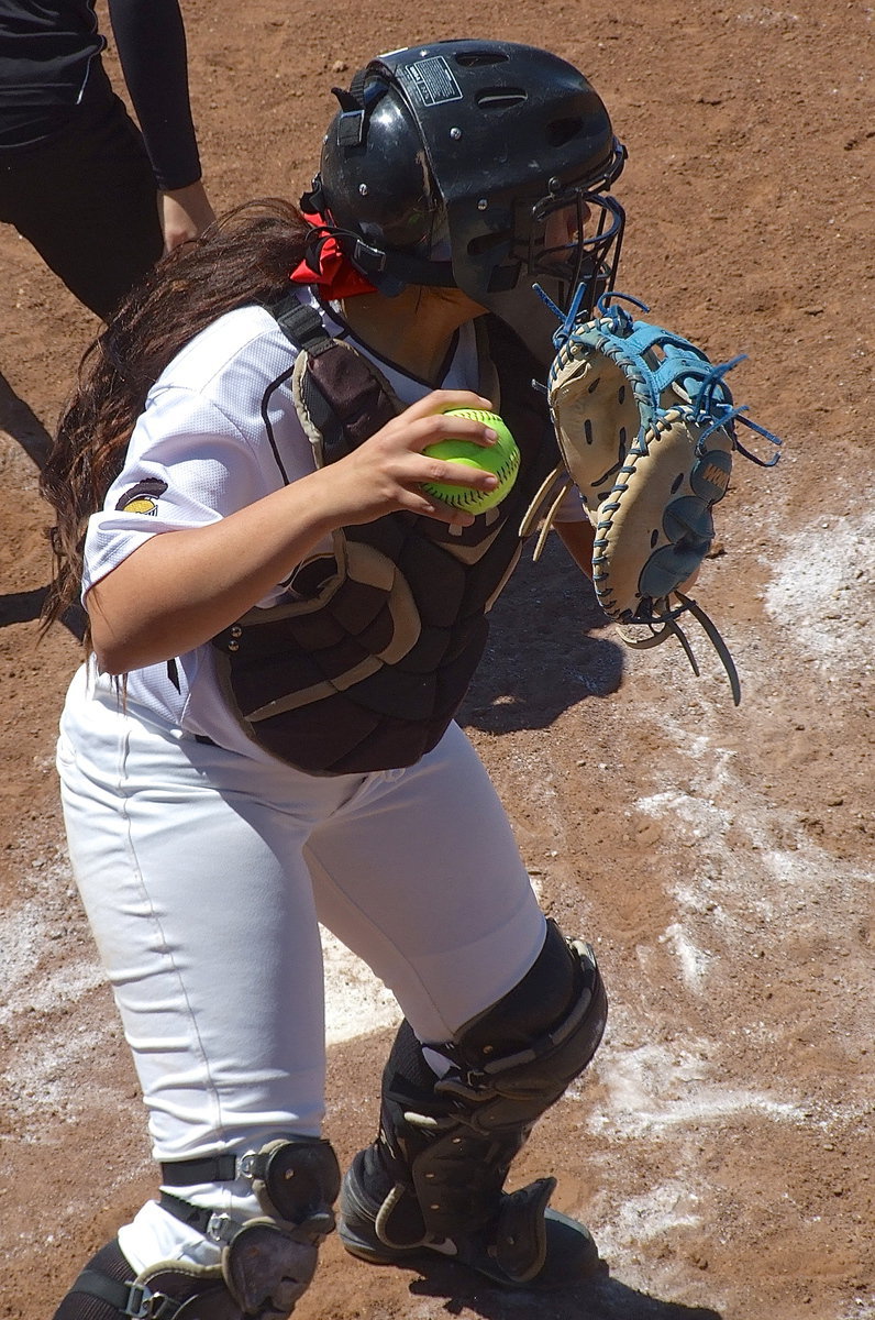 Image: Catcher Alyssa Richards(9) checks a Ferris runner at first base.