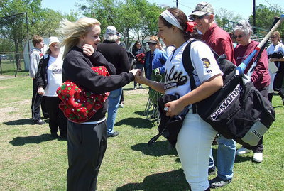 Image: Former Lady Gladiator pitcher and 2010 grad Courtney Westbrook(10) reunites with her old catcher Alyssa Richards(9). The stories these two could tell.