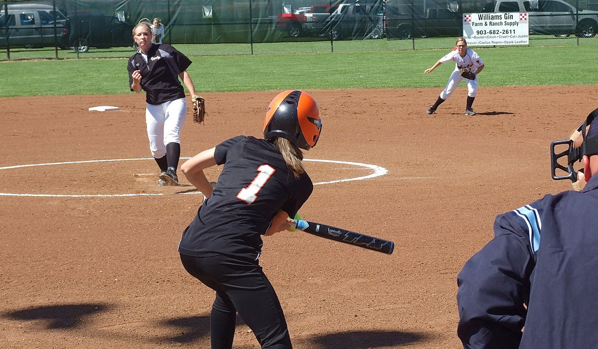 Image: Jaclynn Lewis(15) and second baseman Bailey Eubank(1) react to a bunt coming from Ferris.