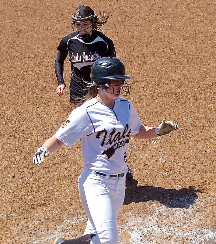 Image: Madison Washington(2) beats Ferris to the punch to score an Italy run.