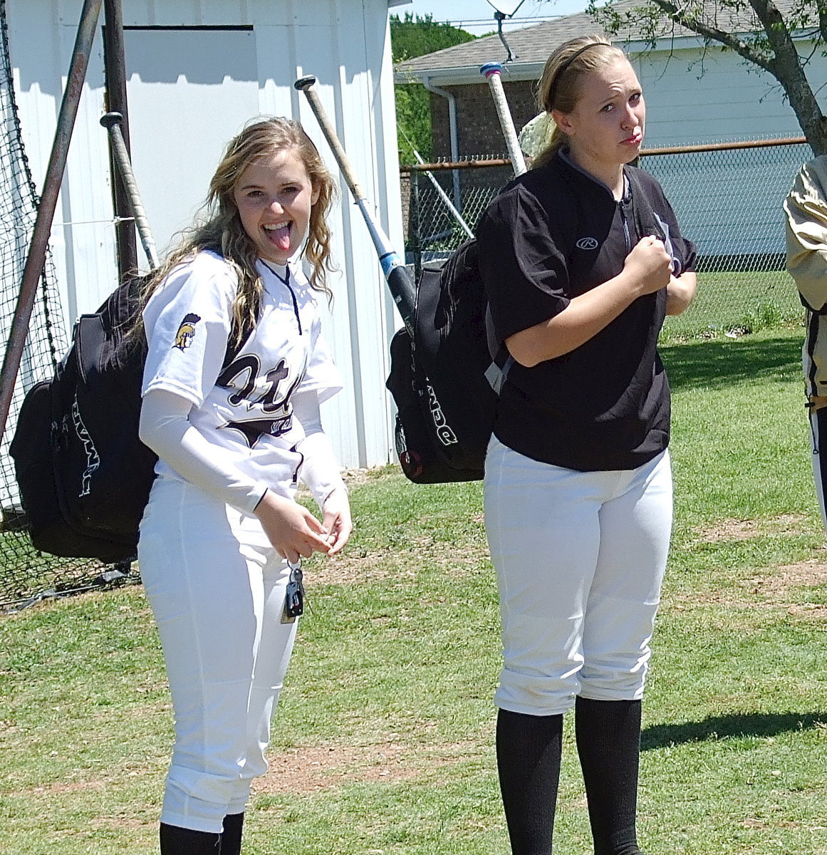 Image: Softball has many highs and lows but teammates Kelsey Nelson(14) and Jaclynn Lewis(15) have endured it all to be undefeated district champions and then win two warm-up games in preparation for the playoffs.