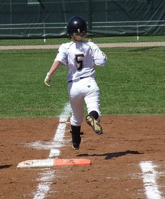 Image: Tara Wallis(5) flies to first base.