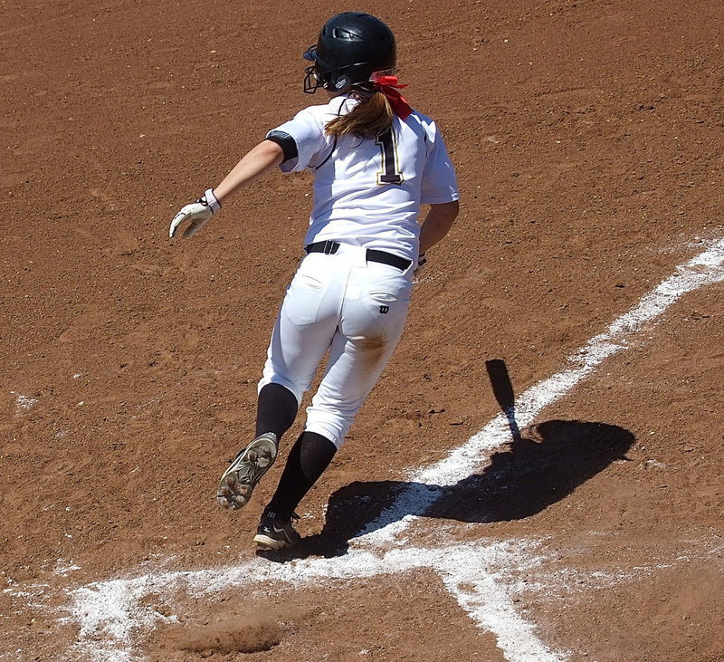 Image: Sophomore Bailey Eubank(1) slaps and then heads to first base.