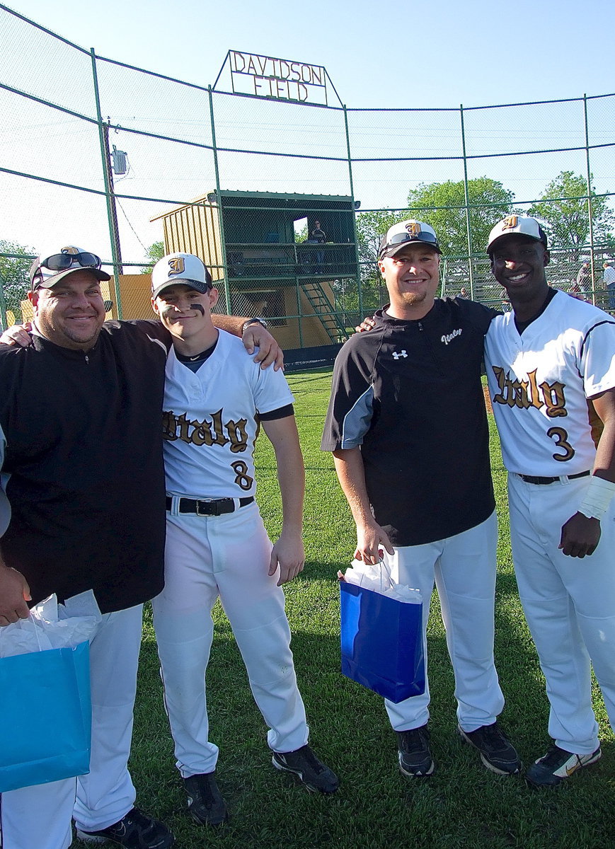 Image: Senior Gladiators Hayden Woods(8) and marvin Cox(3) present assistant coach Brian Coffman and head coach Josh Ward with gift bags as thanks for their efforts in leading Italy to a district championship and into the playoffs.