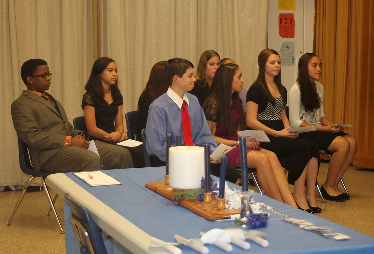 Image: Jarvis Harris, Elijah Garcia and their fellow inductees try to contain their excitement.