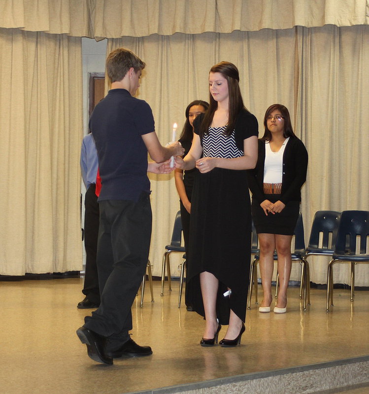 Image: Levie McBride passes the torch to Brooke DeBorde.