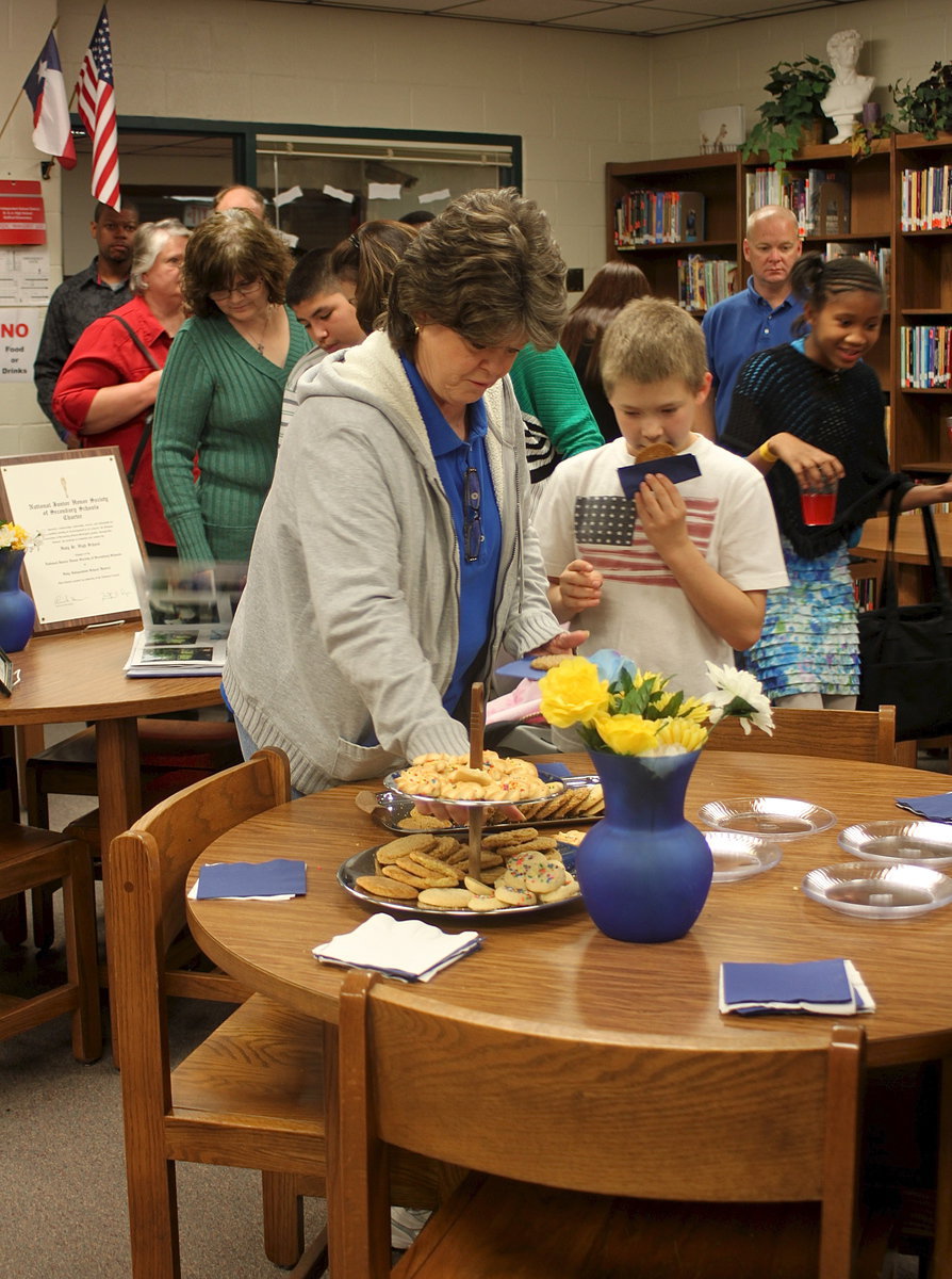 Image: Kay Chambers and her grandson Tanner Chambers feast after supporting granddaughter, sister and new NJHS member Britney Chambers.