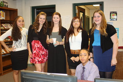 Image: Newly inducted NJHS members Vanessa Cantu, Lillie Perry, Brooke DeBorde, Kimberly Mata, Christy Murray and Devonteh Williams pose during the reception while fellow inductees Jarvis Harris and April Lusk are off sampling deserts.