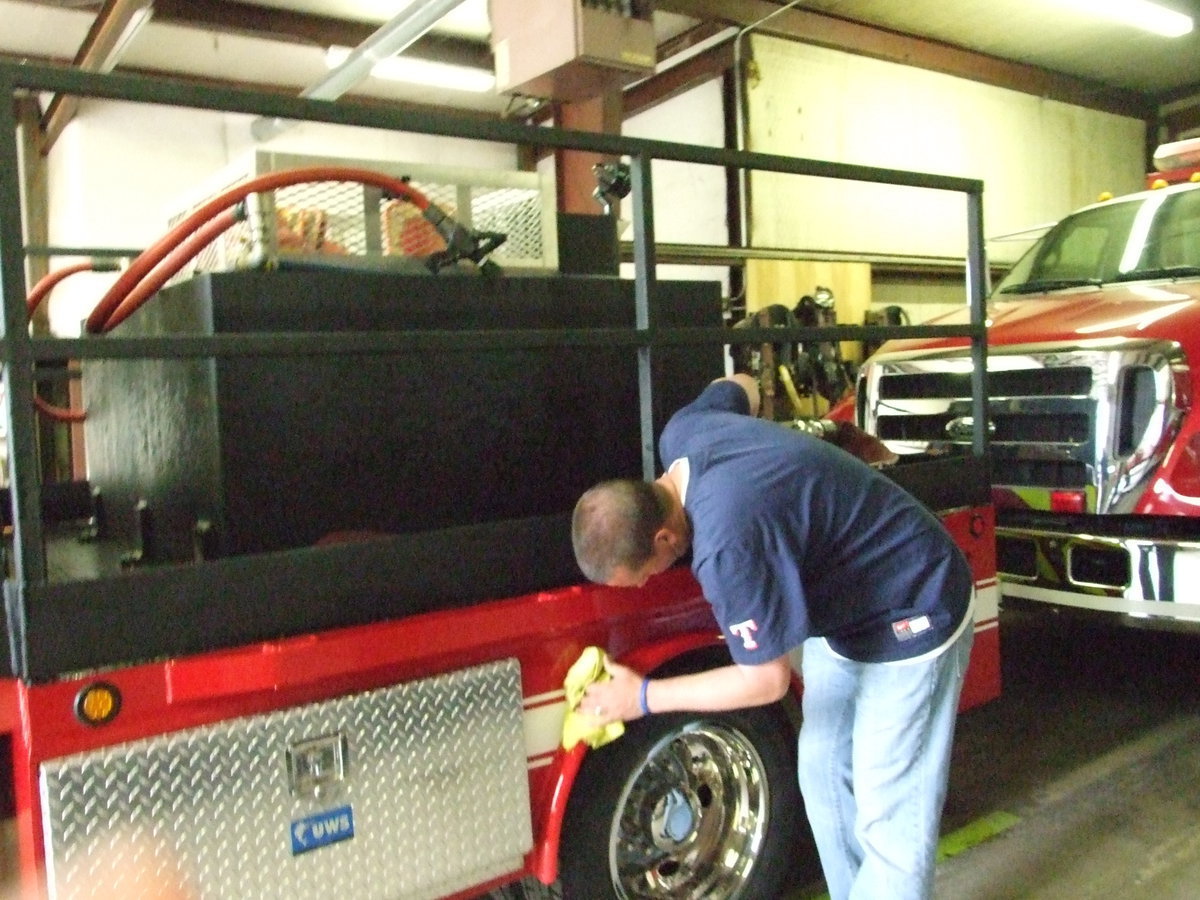 Image: Josh Droll wiping the truck for any water left behind.