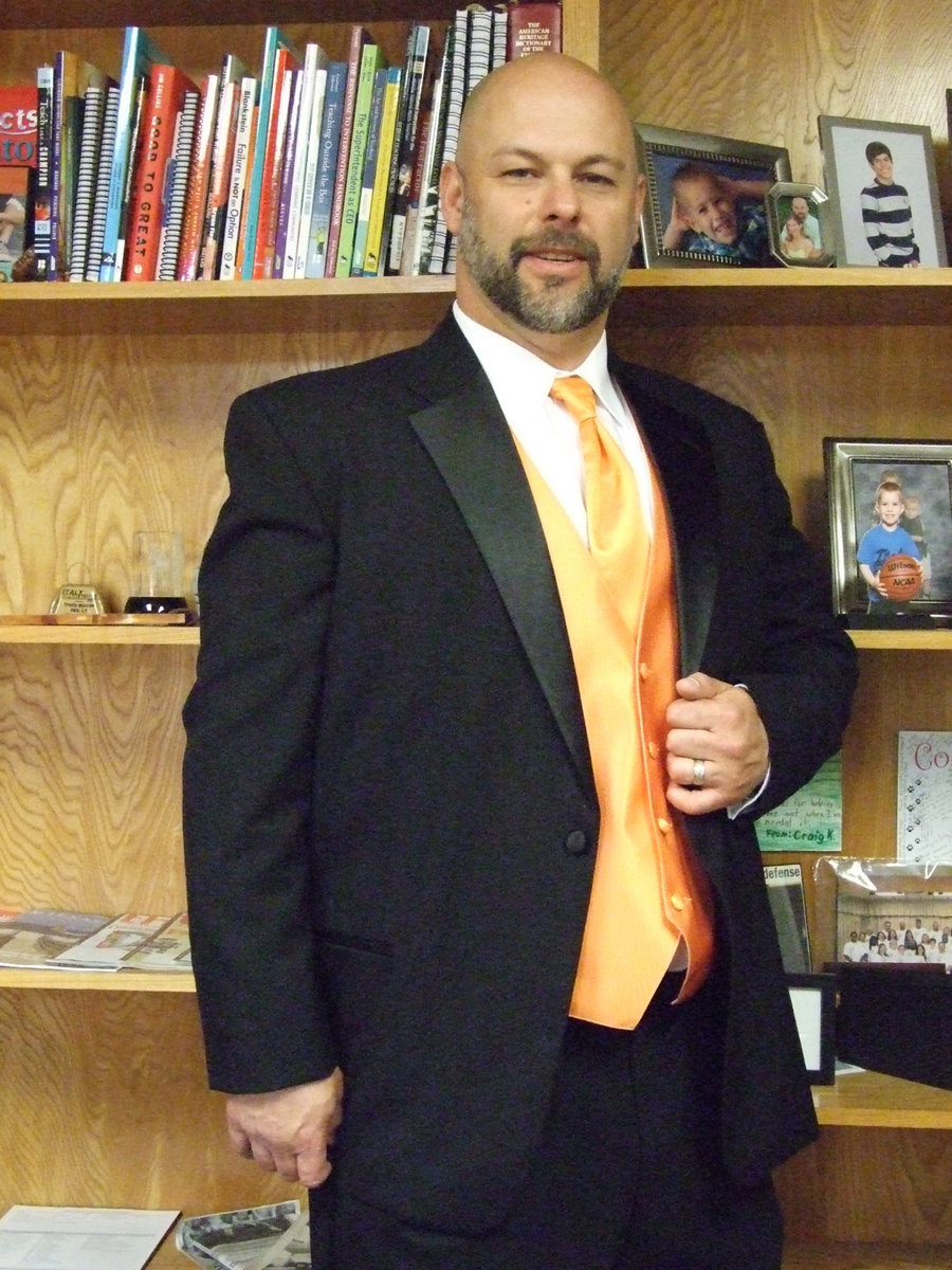 Image: Lee Joffre, principal at Italy High School, wears a tuxedo (rented from Lone Star Western Wear in Waxahachie) to remind the students to purchase their prom tickets.