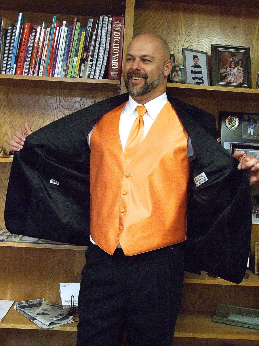 Image: Mr. Joffre shows Ms. Moreland how wonderful the tuxedo is and how the young men at IHS can rent one too.