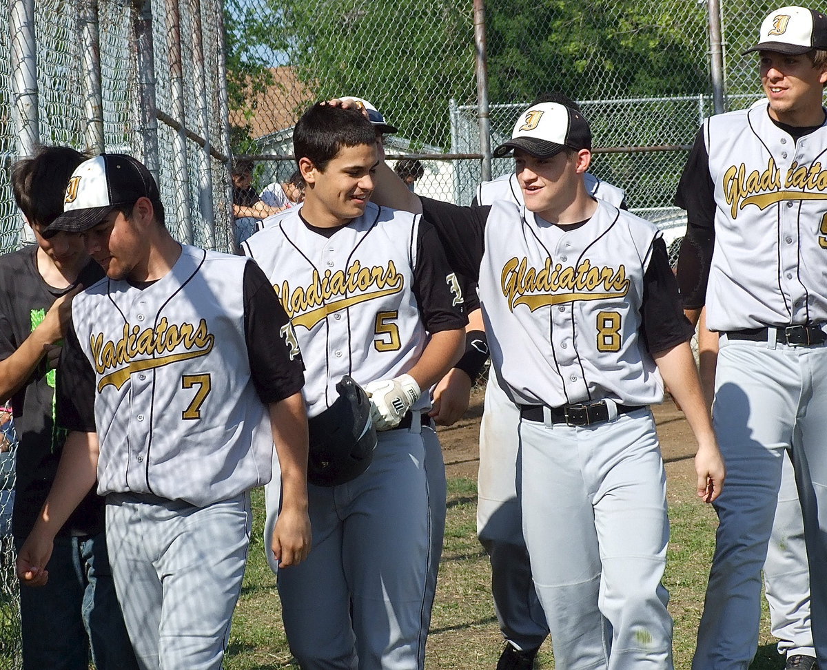 Image: Hayden Woods(8) congratulates fellow senior Reid Jacinto(5) on going yard.