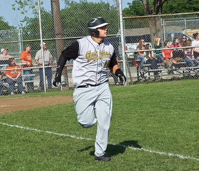 Image: Kevin Roldan(16) runs to first as he watches his hit clear the fence for Italy’s second homerun of the game.