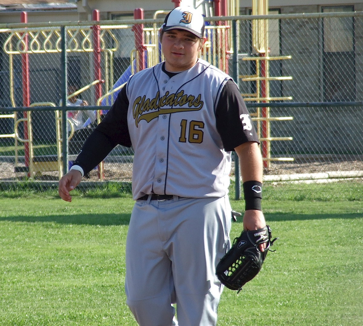 Image: Winning the district title was kids play for right fielder Kevin Roldan(16) and the Gladiators.