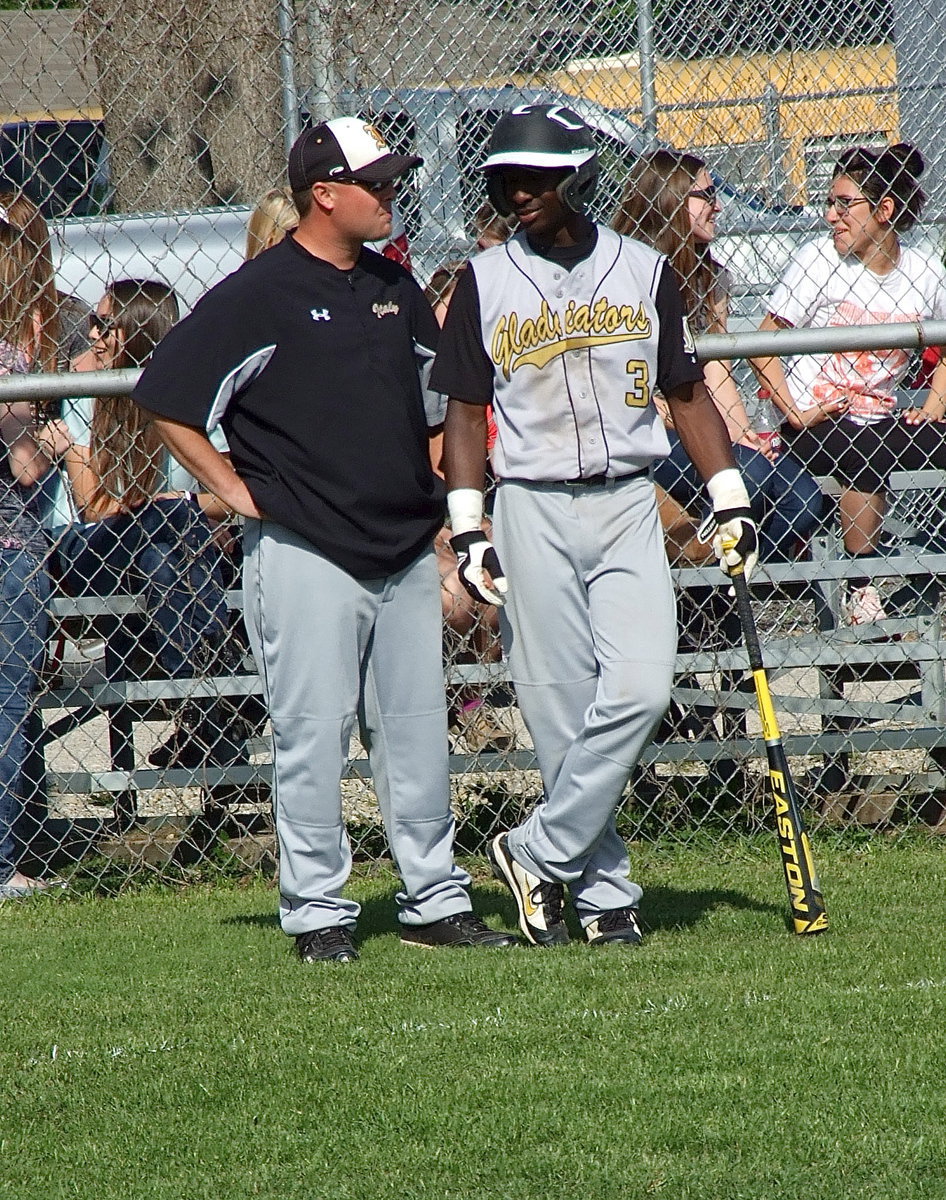 Image: Italy Baseball Head Coach Josh Ward chats with Marvin Cox(3).