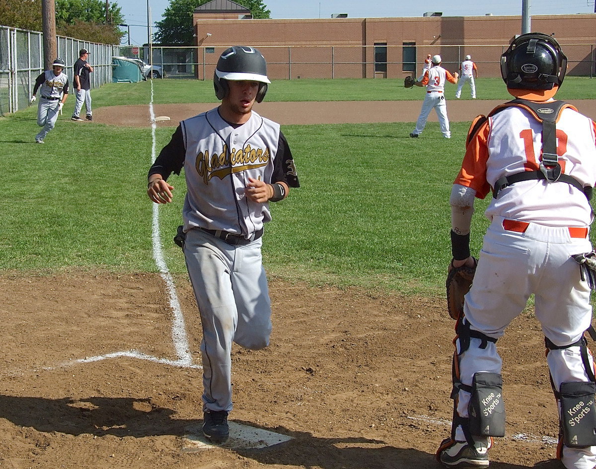 Image: Caden Jacinto(1) touches home plate for an Italy run.