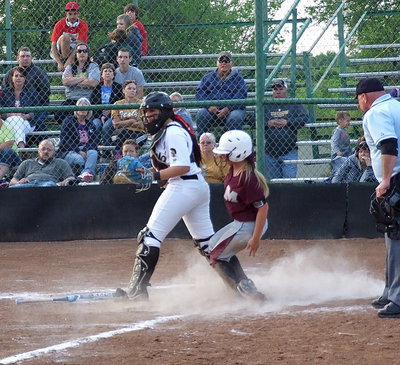 Image: Senior brick wall Alyssa Richards(9) gets the force out at home plate with Italy refusing to allow Mildred to score despite the bases being loaded.