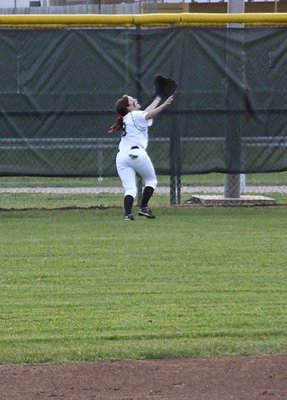 Image: Look at the grace, look at the determination as senior right fielder Morgan Cockerham(8) tries to make the catch at the wall for Italy.