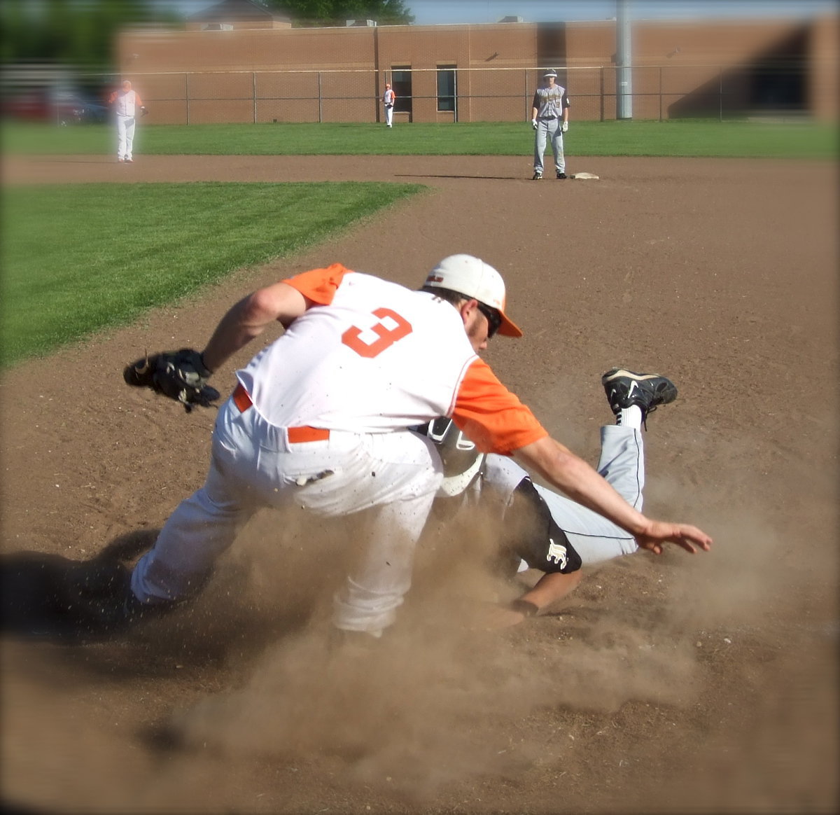 Image: Avalon’s Reece Marshall(3) meets the italian hurricane, John “Squirt” Hughes(6), who disrupts the throw to make it back to first base.