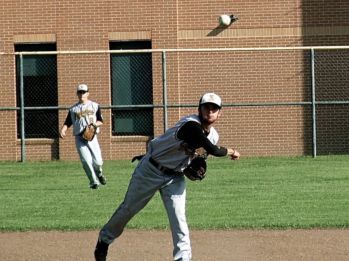 Image: Left fielder Hayden Woods(8) backsup shortstop Caden Jacinto(1) who throws to Cole Hopkins at first base for an Italy out against Avalon.