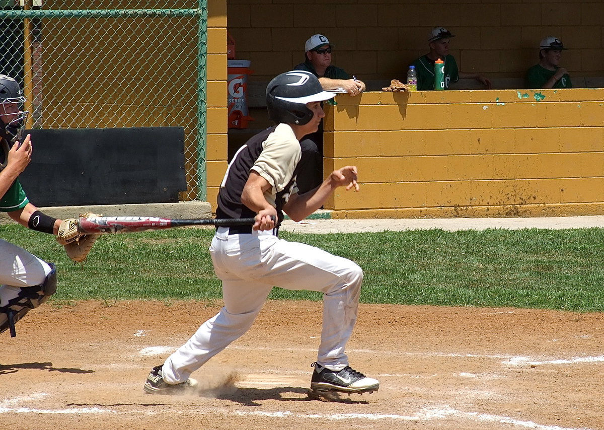 Image: Italy’s Levi McBride(1) swats his way onto the bases.