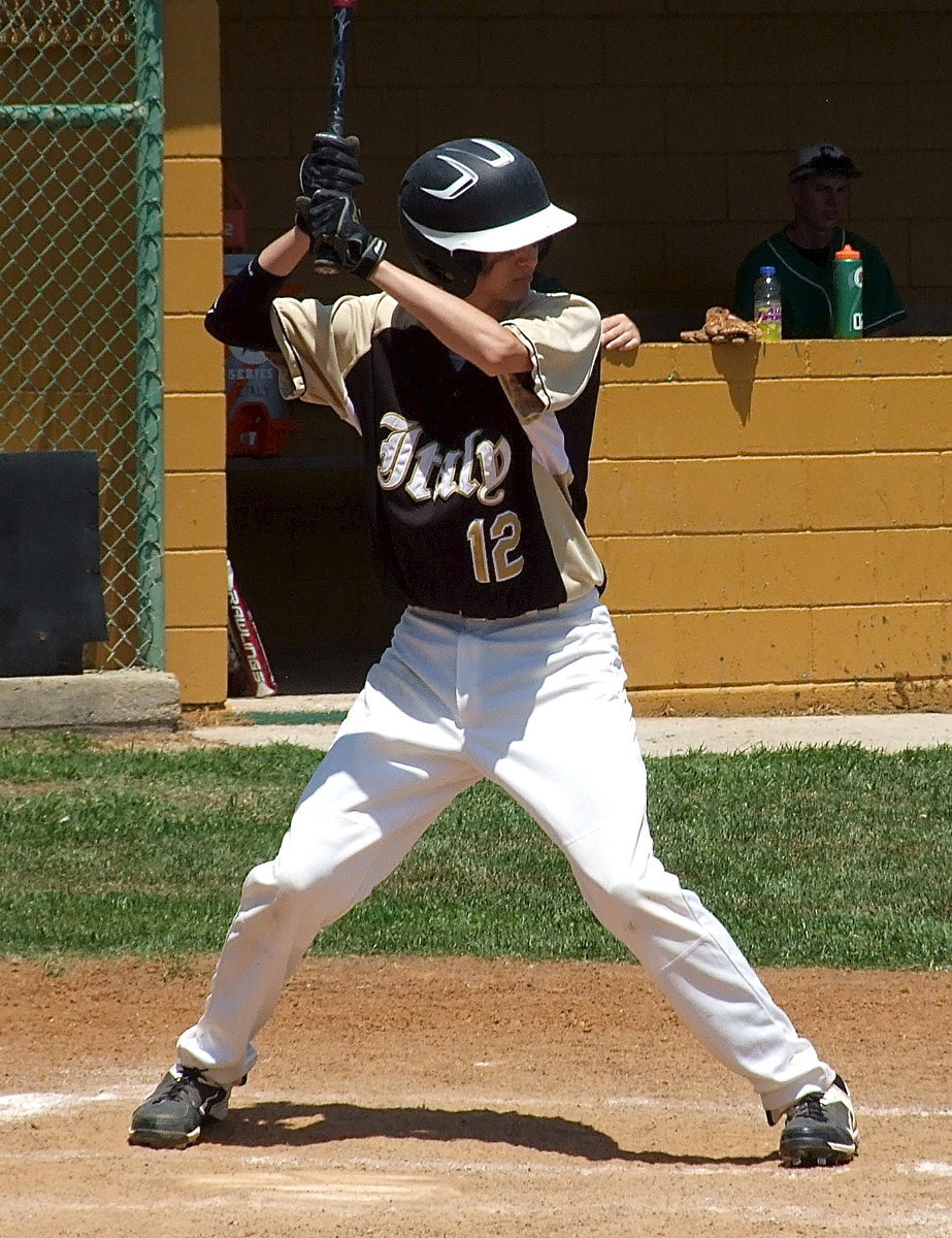 Image: Ty Windham(12) duels with Clifton’s pitcher.