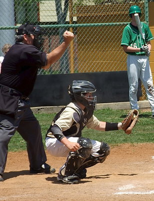 Image: Catcher John Escamilla(3) hauls in a third strike pitch from pitcher Ty Windham.