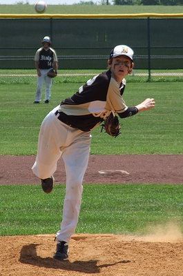Image: Ty Windham(12) keeps working at pitcher.