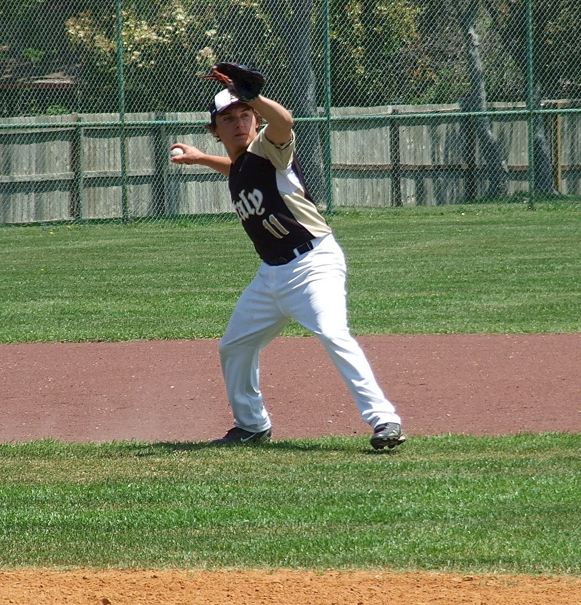 Image: Third baseman Chace McGinnis(11) stays at the ready.