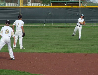 Image: Center fielder Kyle Fortenberry(14) relays the ball into Levi McBride(1) and Clayton Miller(8).