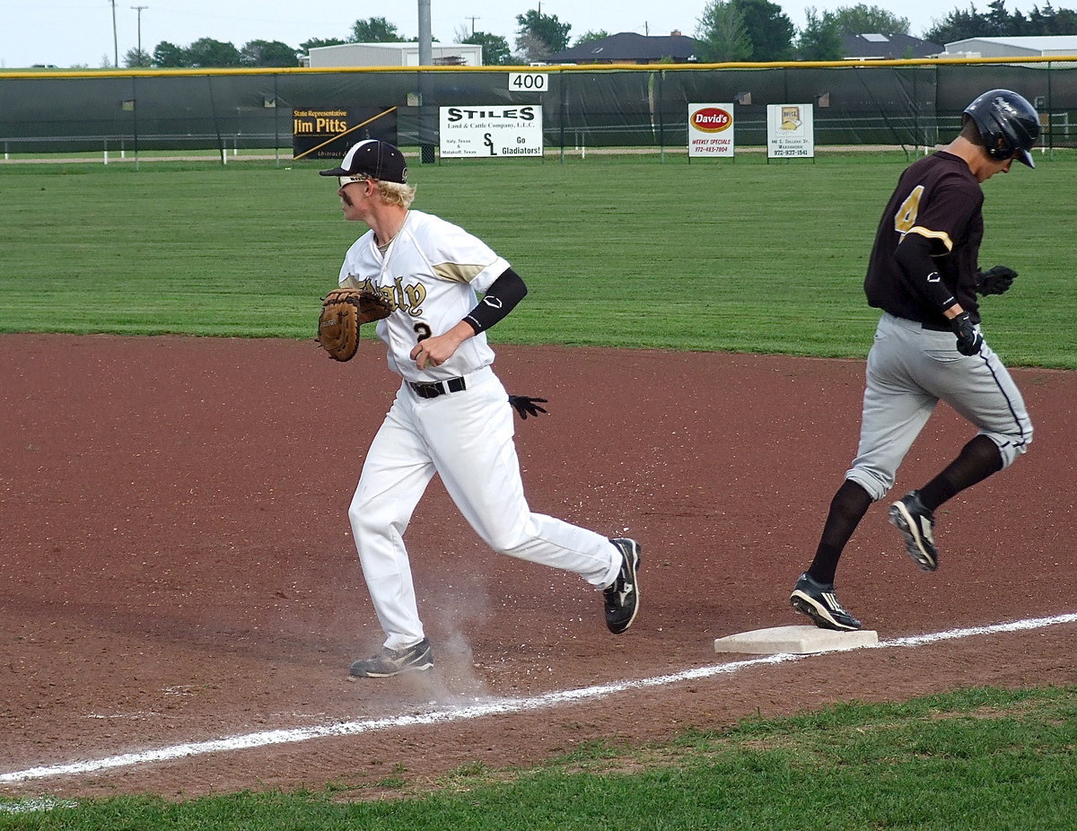 Image: First baseman Cody Boyd(2) makes the catch for an Italy out and then quickly looks for more Pirates.