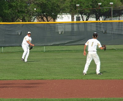 Image: Left fielder Colin Newman(17) relays the ball into shortstop Levi McBride(1).