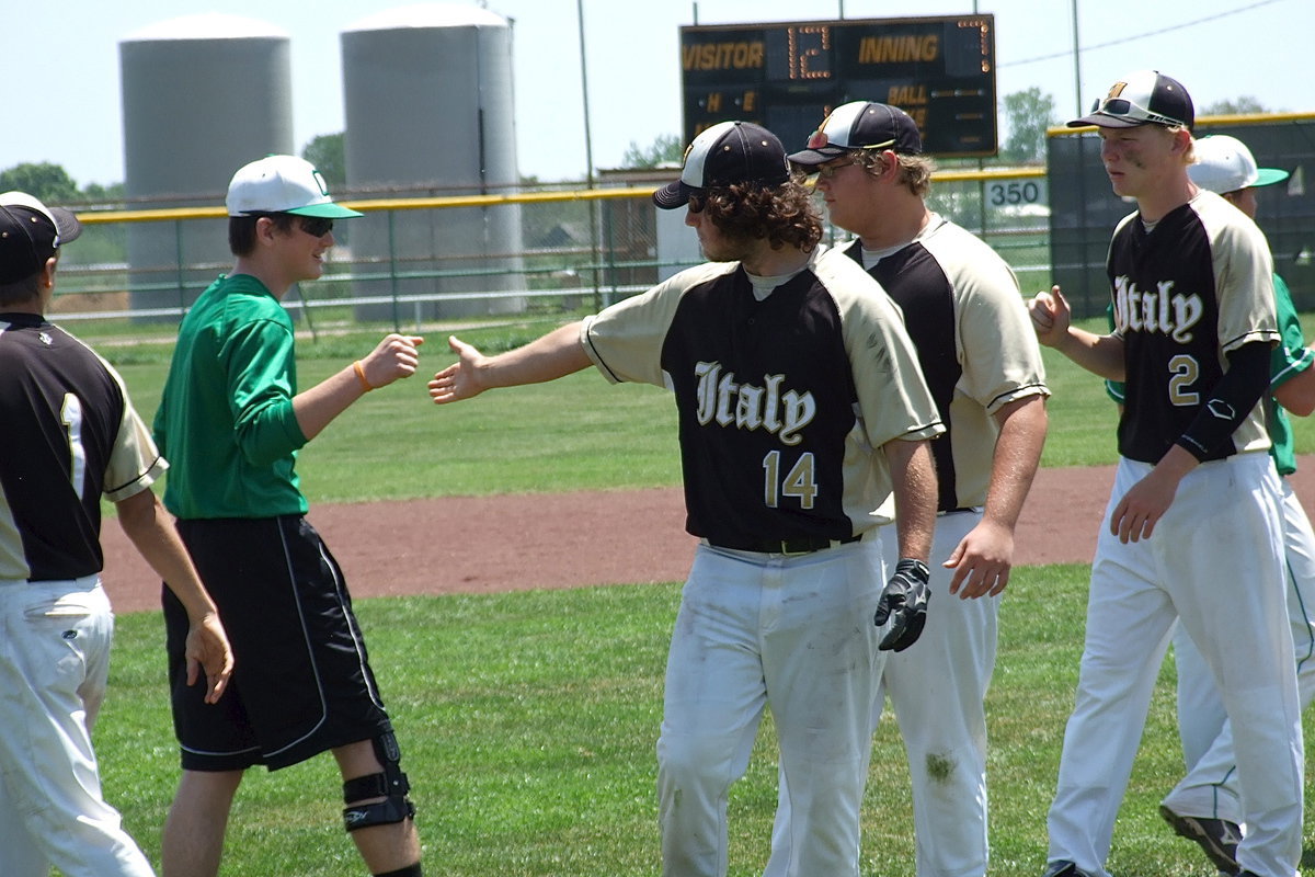 Image: Levi McBride(1), Kyle Fortenberry(14), Colin Newman(17) and Cody Boyd(2) show good sportsmanship with an injured Clifton player after the game.