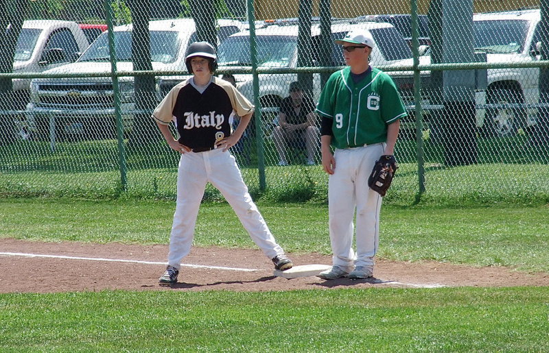 Image: Italy’s Clayton Miller(8) reaches first base against Clifton.