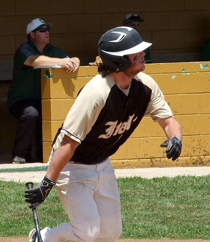 Image: Kyle Fortenberry(14) hits the ball deep against Clifton.