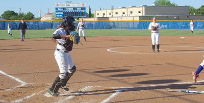 Image: Italy catcher Alyssa Richards(9) manages to throw out a hopeful Gorman batter at first base.