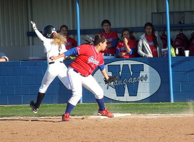 Image: Britney Chambers(4) is called out on a close call at first base.