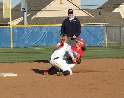Image: Shortstop Madison Washington(2) combines with catcher Alyssa Richards to make the tag on a steal attempt by Gorman.