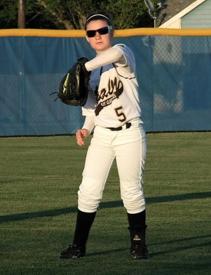 Image: Lady Gladiator outfielder Tara Wallis(5) gets ready for the finale against Gorman.